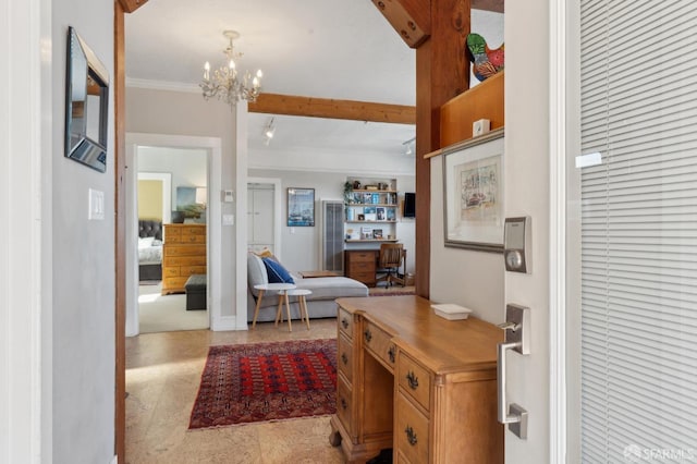 foyer entrance with an inviting chandelier and crown molding