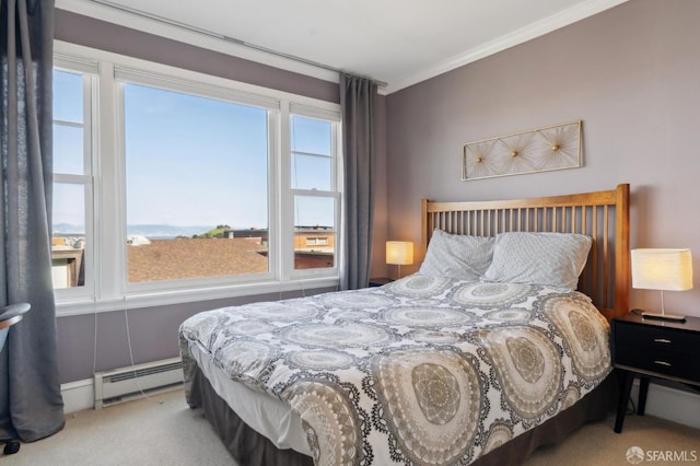 carpeted bedroom with baseboard heating and crown molding