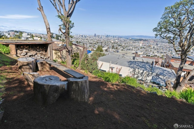 view of yard featuring a view of city