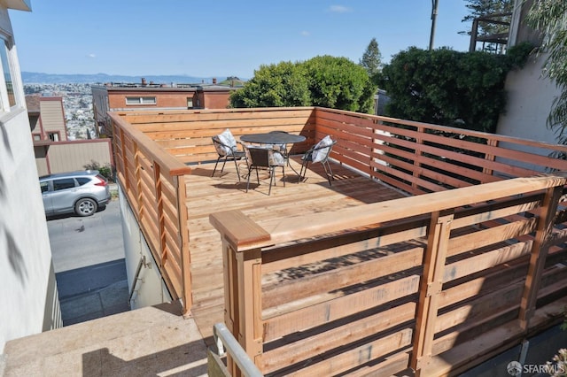 wooden deck featuring outdoor dining space