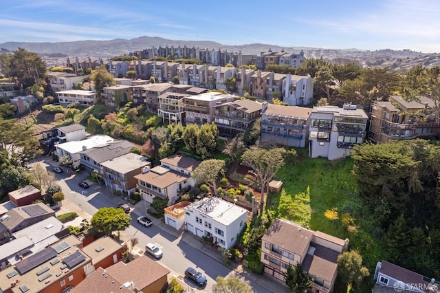 aerial view featuring a mountain view and a residential view