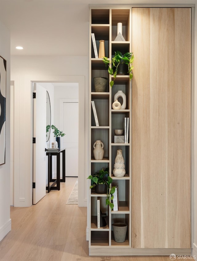 corridor featuring light hardwood / wood-style floors