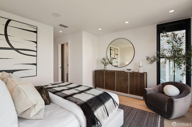 bedroom with light wood-type flooring