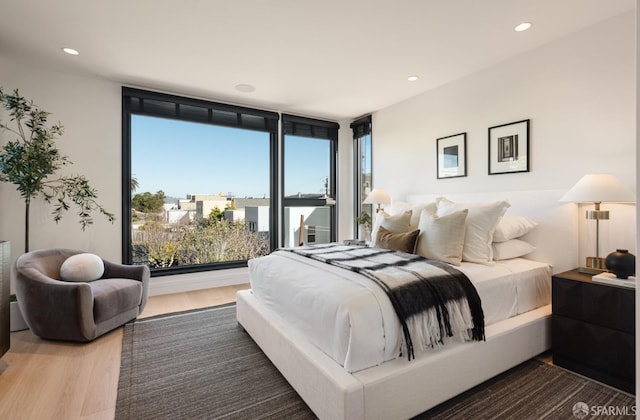 bedroom with wood-type flooring