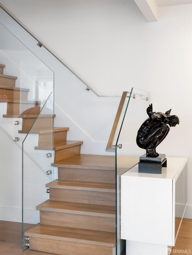 stairs with wood-type flooring