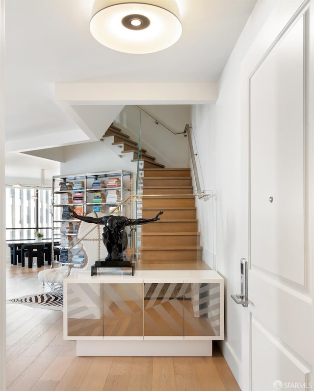 stairway featuring hardwood / wood-style flooring