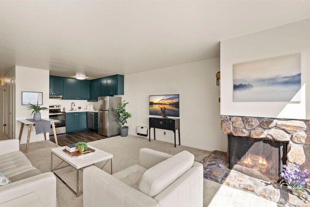 655 Corbett Ave Unit 505, San Francisco, CA 94114 - living area featuring a stone fireplace and dark carpet