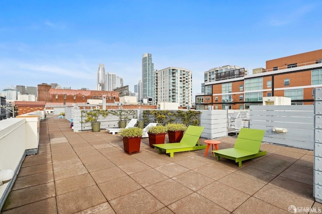 view of patio featuring a balcony