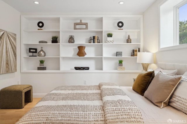 bedroom featuring wood finished floors and recessed lighting