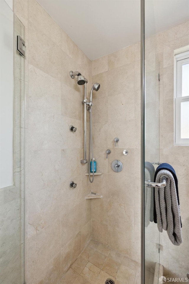 bathroom featuring a shower stall