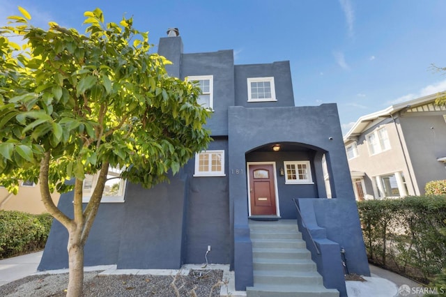 view of front of house featuring stucco siding