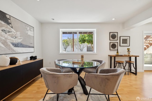 dining area featuring recessed lighting, baseboards, and light wood finished floors