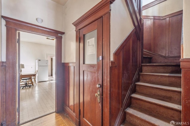 stairway with wood finished floors