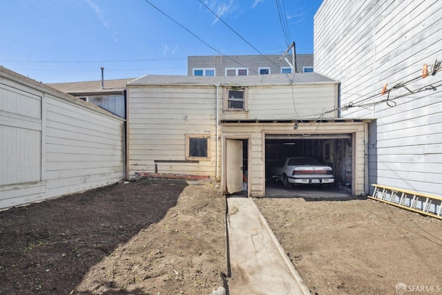 exterior space featuring a garage and driveway