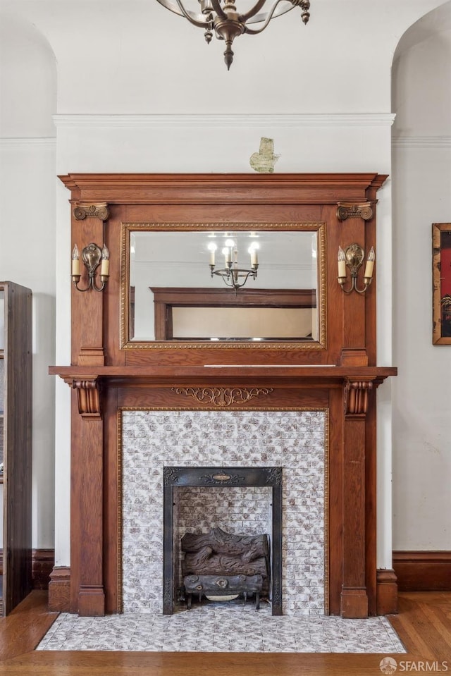 interior details with a fireplace and wood finished floors