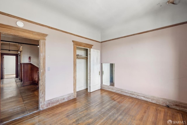 spare room with wood finished floors