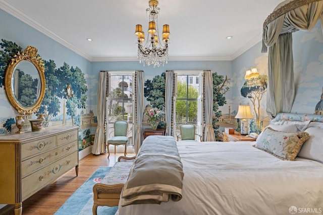 bedroom featuring a notable chandelier, ornamental molding, recessed lighting, wood finished floors, and access to outside