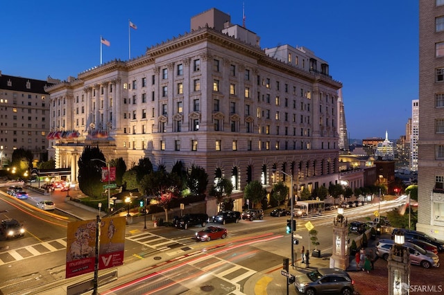 view of outdoor building at dusk