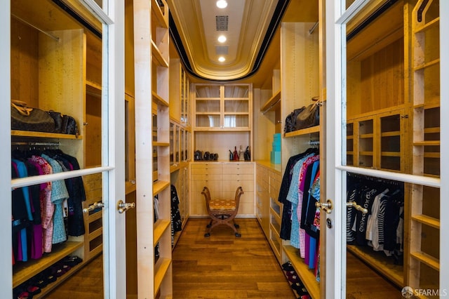 spacious closet with dark wood-type flooring