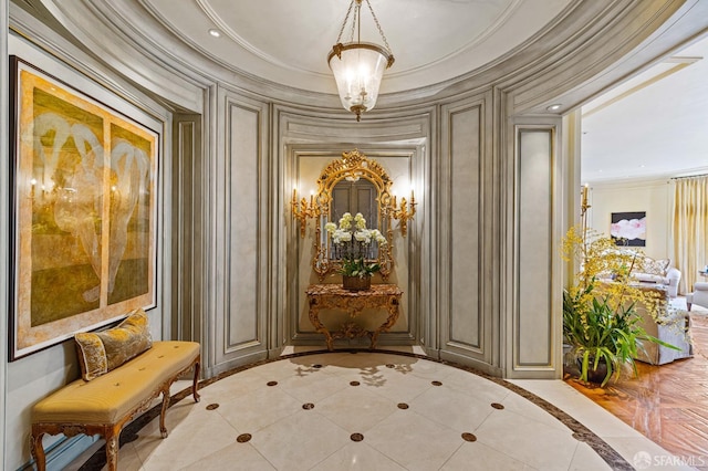 interior space with light tile patterned floors, ornamental molding, and a notable chandelier