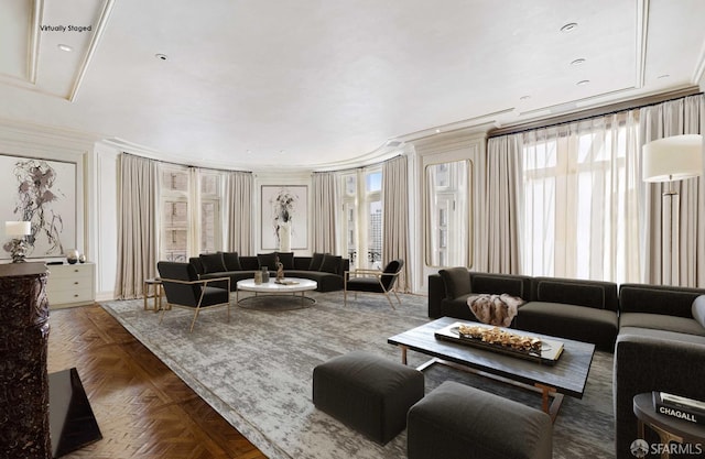 living room with dark parquet floors and crown molding