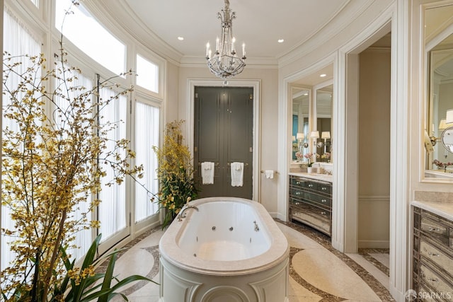 bathroom featuring a bathtub, vanity, a healthy amount of sunlight, and a notable chandelier