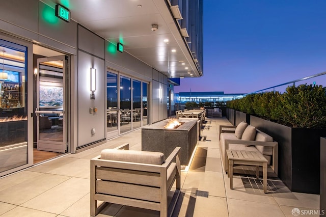 706 Mission St Unit 1001, San Francisco, CA 94103 - patio terrace at dusk with an outdoor living space with a fire pit