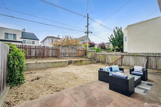 view of patio / terrace featuring an outdoor hangout area and a fenced backyard
