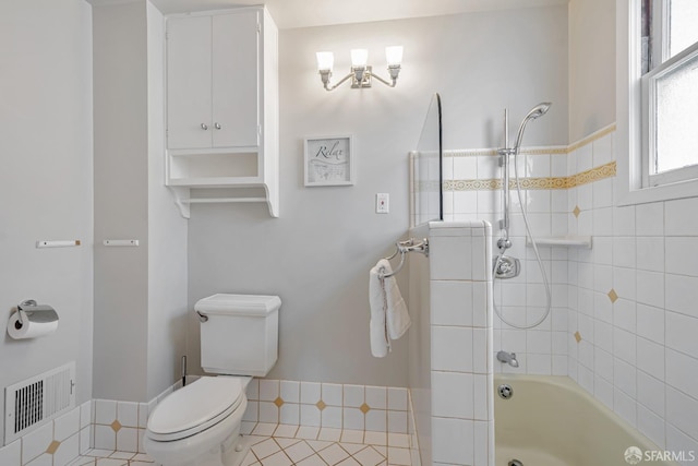 bathroom featuring toilet and shower / tub combination