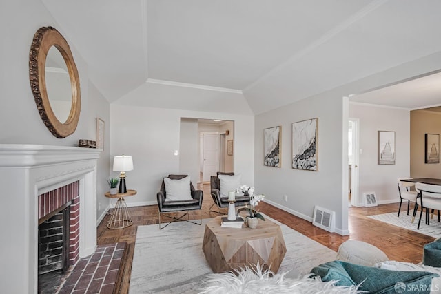 living area with baseboards and a brick fireplace