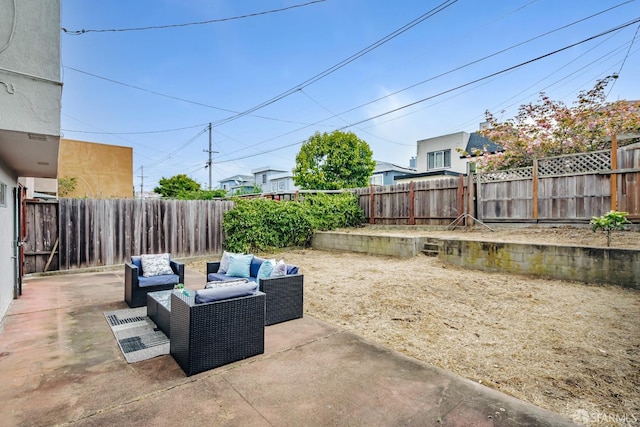 view of patio with an outdoor living space and a fenced backyard