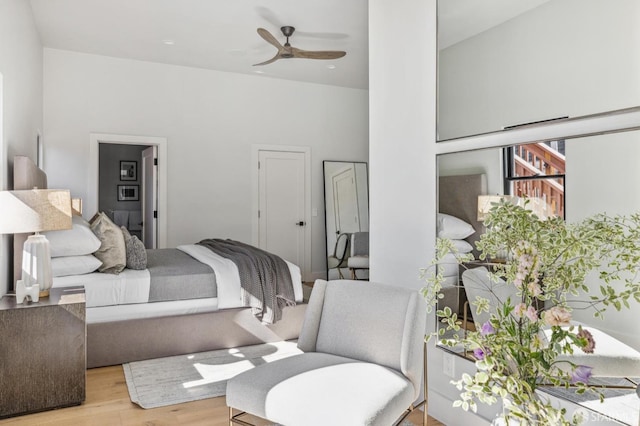 bedroom with light wood-type flooring and ceiling fan