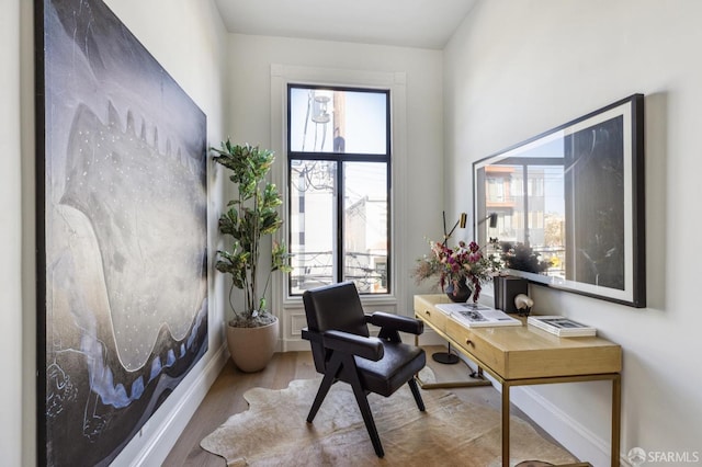 office with hardwood / wood-style flooring