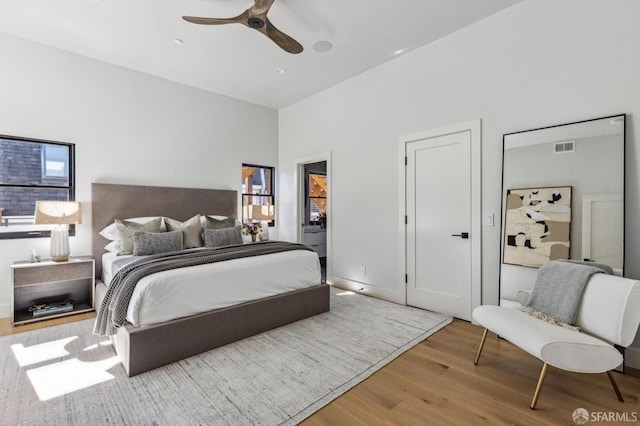 bedroom featuring ceiling fan and light hardwood / wood-style floors