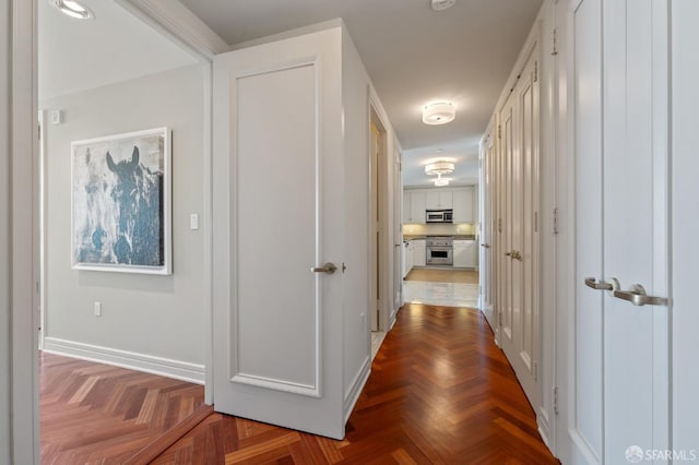 corridor featuring baseboards