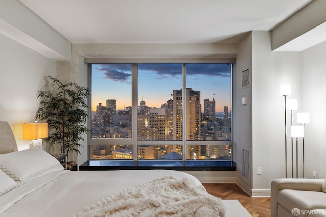 bedroom with a view of city and visible vents