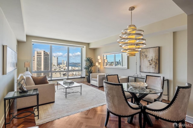 dining room with a city view and a chandelier