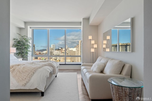 bedroom featuring a city view