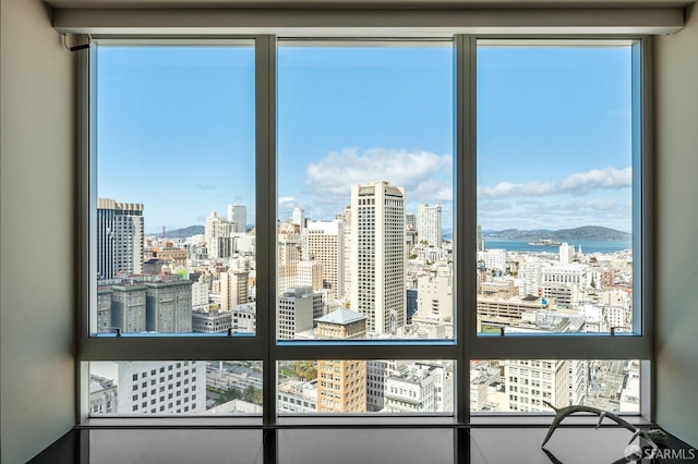 interior details featuring a view of city and a water view