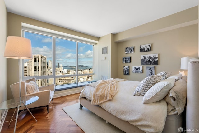 bedroom featuring visible vents and a view of city