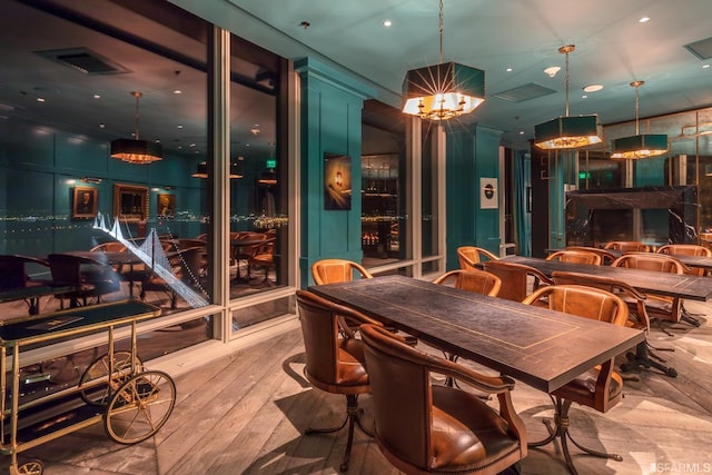 dining room featuring a notable chandelier and light wood-type flooring