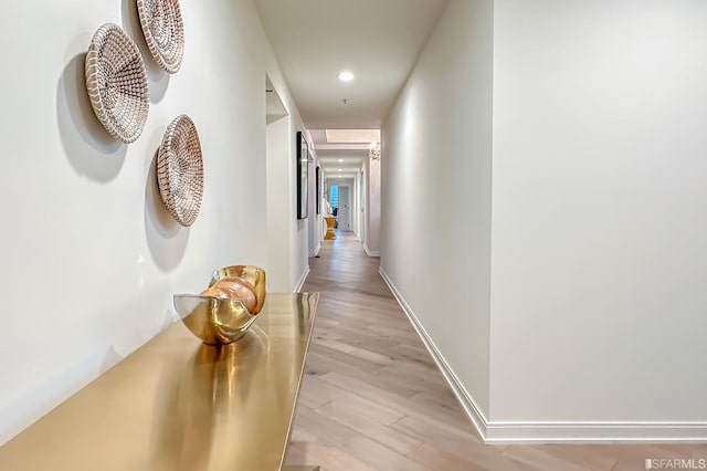 hall with light hardwood / wood-style floors