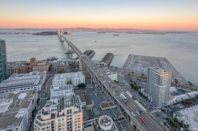 aerial view at dusk with a water view