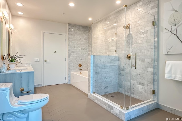 full bathroom with vanity, independent shower and bath, and tile patterned flooring