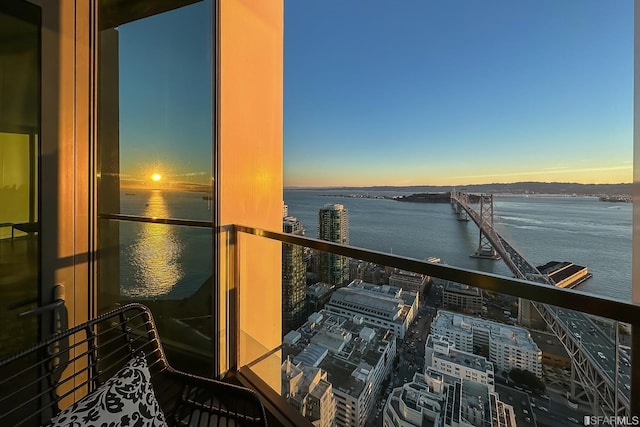 balcony at dusk with a water view