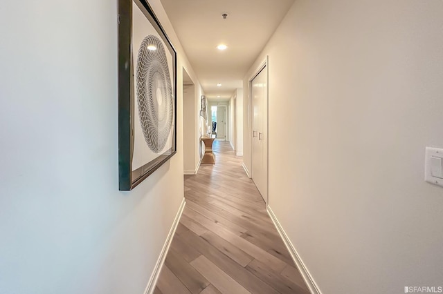 corridor featuring light hardwood / wood-style floors