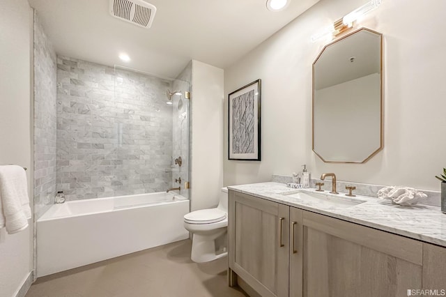 full bathroom featuring vanity, toilet, and tiled shower / bath combo