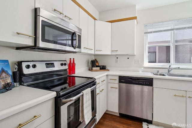 1945 Washington St Unit 412, San Francisco, CA 94109 - kitchen with appliances with stainless steel finishes, a sink, light countertops, and white cabinets