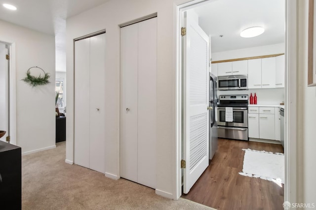 1945 Washington St Unit 412, San Francisco, CA 94109 - corridor with dark carpet and baseboards