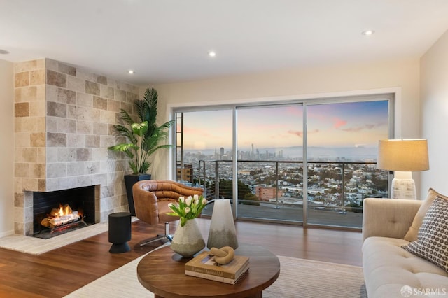 11 Perego Ter Unit 6, San Francisco, CA 94131 - living room with wood finished floors, a fireplace, recessed lighting, and a city view
